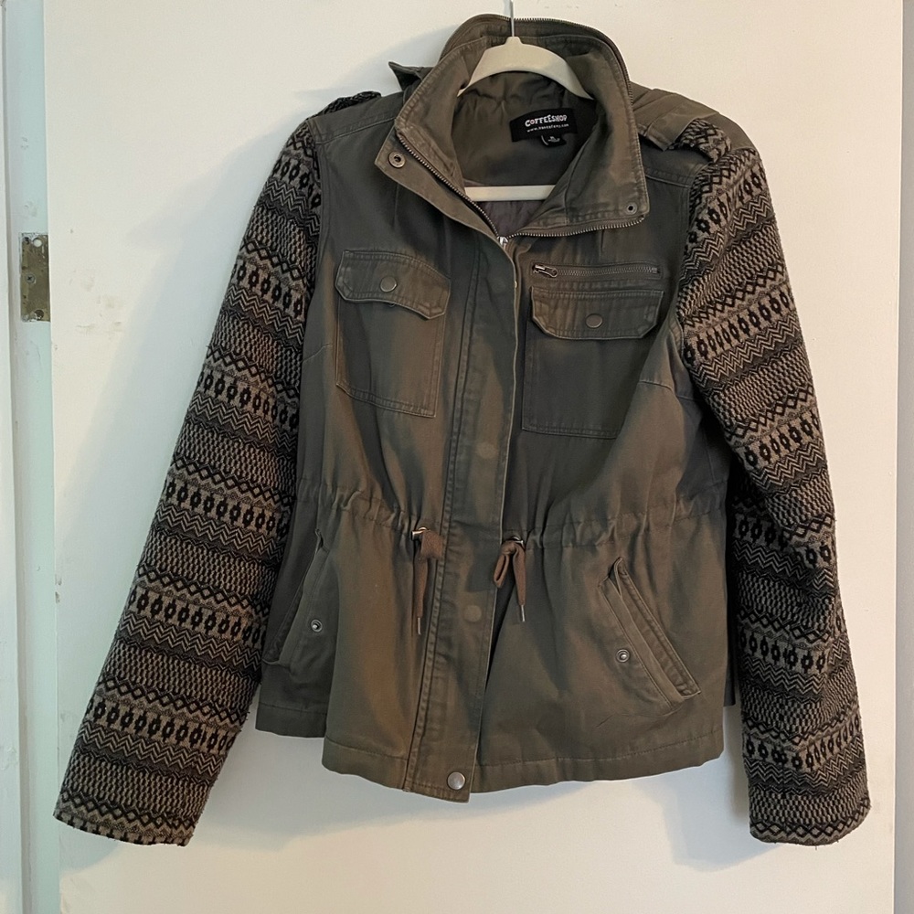 Coffeeshop brand coat with Aztec designed sleeves